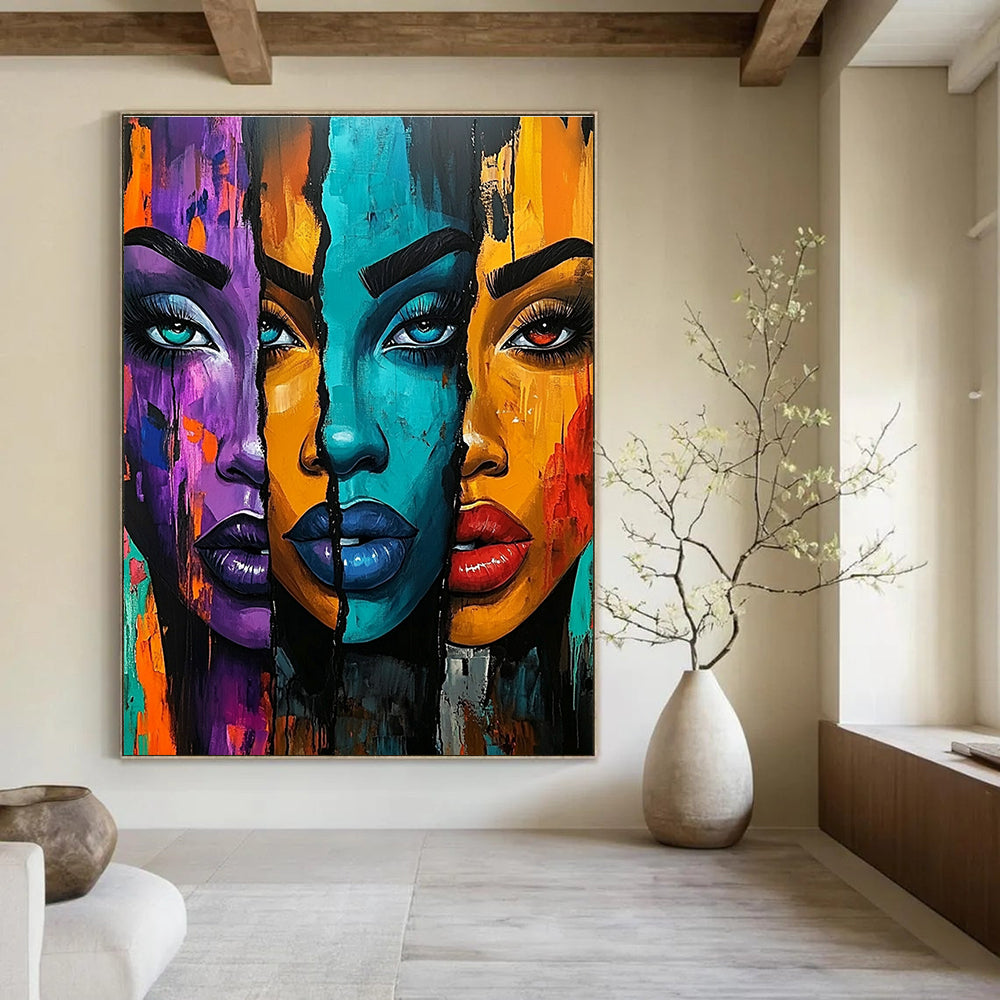 A large abstract painting featuring three vibrant African American women with bold colors and expressive features set against an energetic urban-inspired background.STSC1220