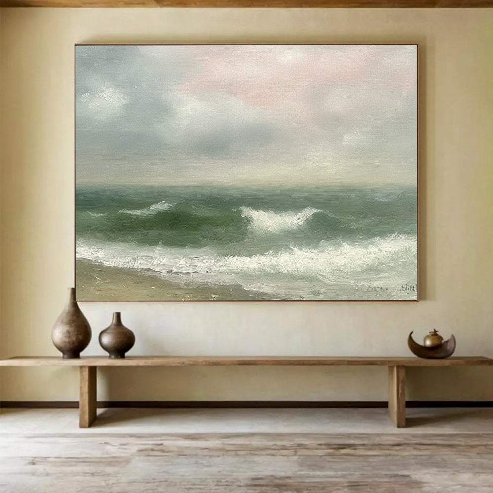 Large abstract painting depicting a vintage seascape with green and gray waves, an empty beach, and a soft pink sky in muted pastels.SC565