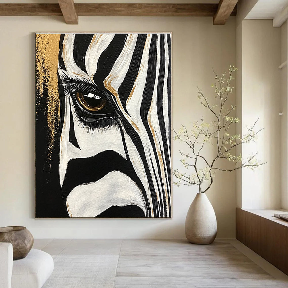 Large abstract painting of a zebra's eye and stripes featuring bold brushstrokes with gold accents against a textured black and white background.STSC956