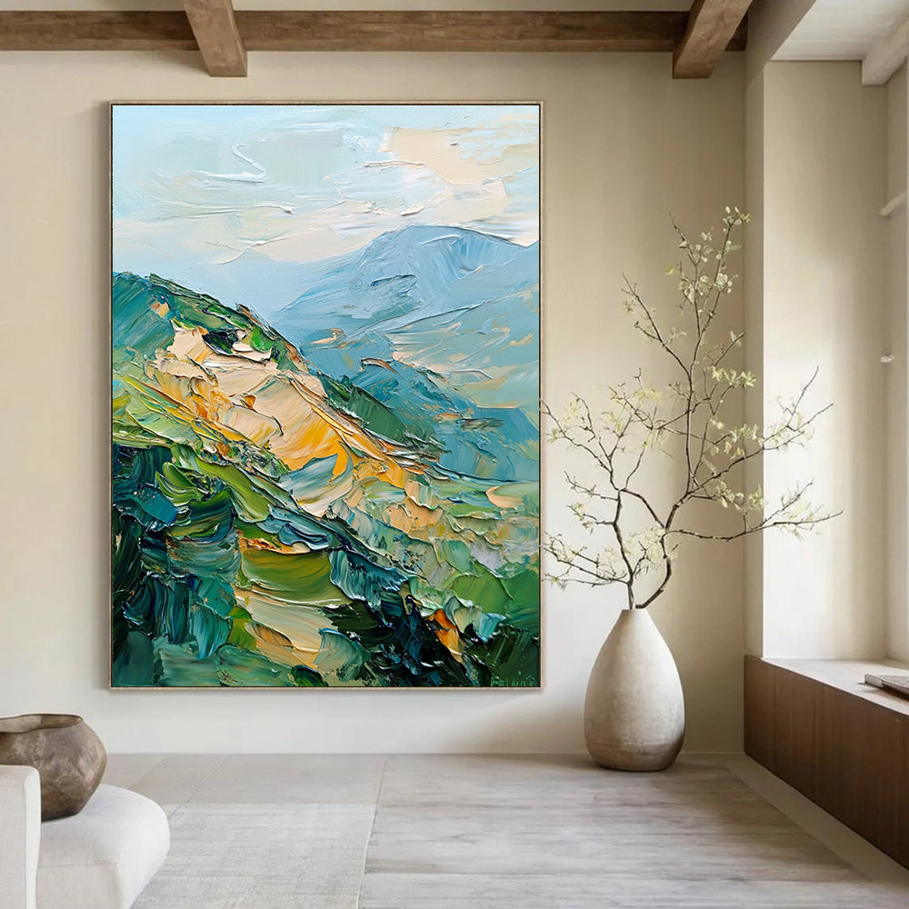 Large abstract painting of mountains featuring palette knife texture and thick brush strokes in a blend of greens blues and golds.STSC192
