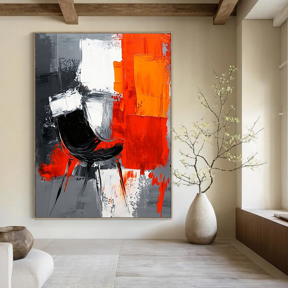 Large abstract painting with gray background featuring white and orange shapes and a contrasting black chair created with oil paint on textured paper.STSC226