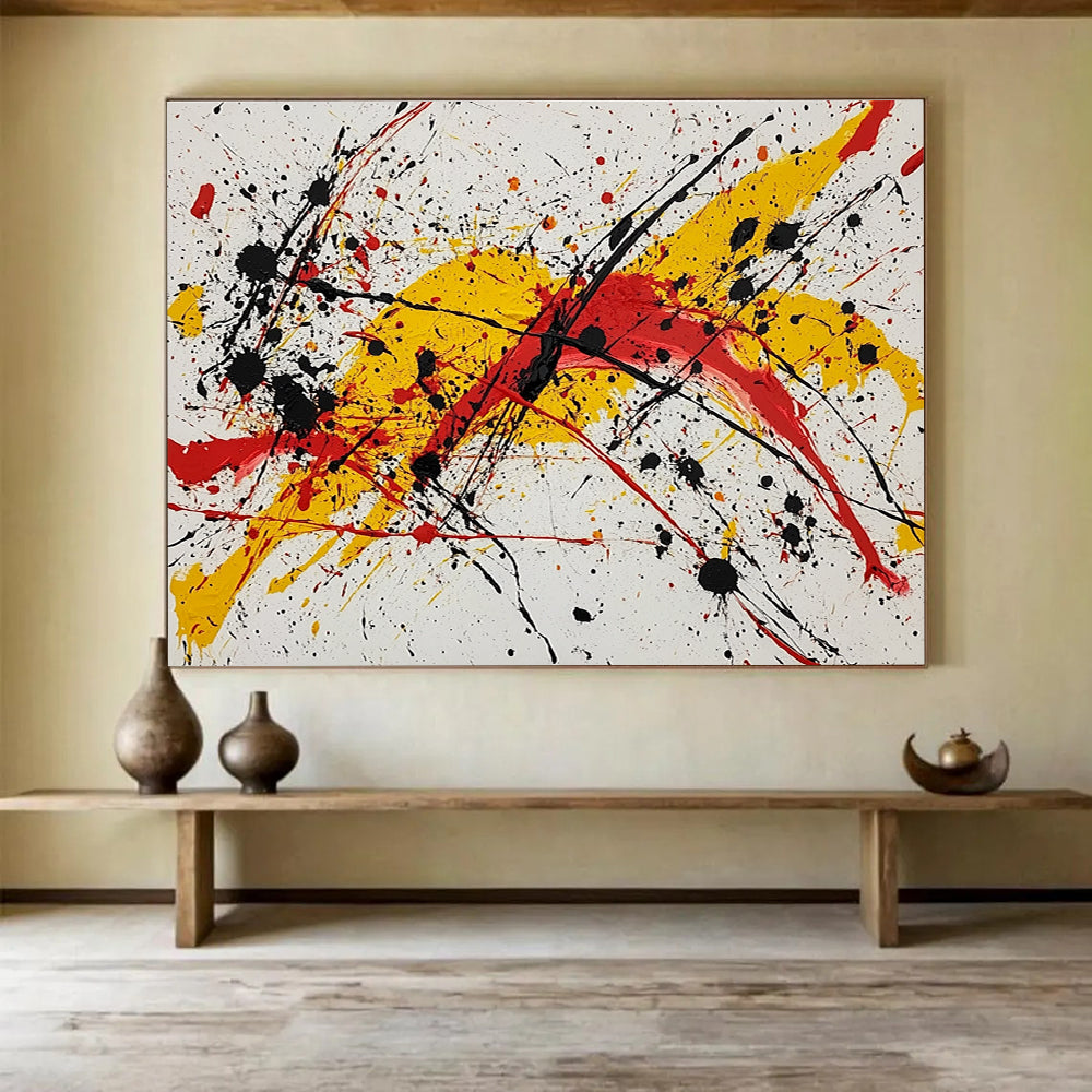 Large abstract painting featuring vibrant red yellow and black splashes evoking energy and freedom through dynamic brushstrokes and harmonious chaos.SC570