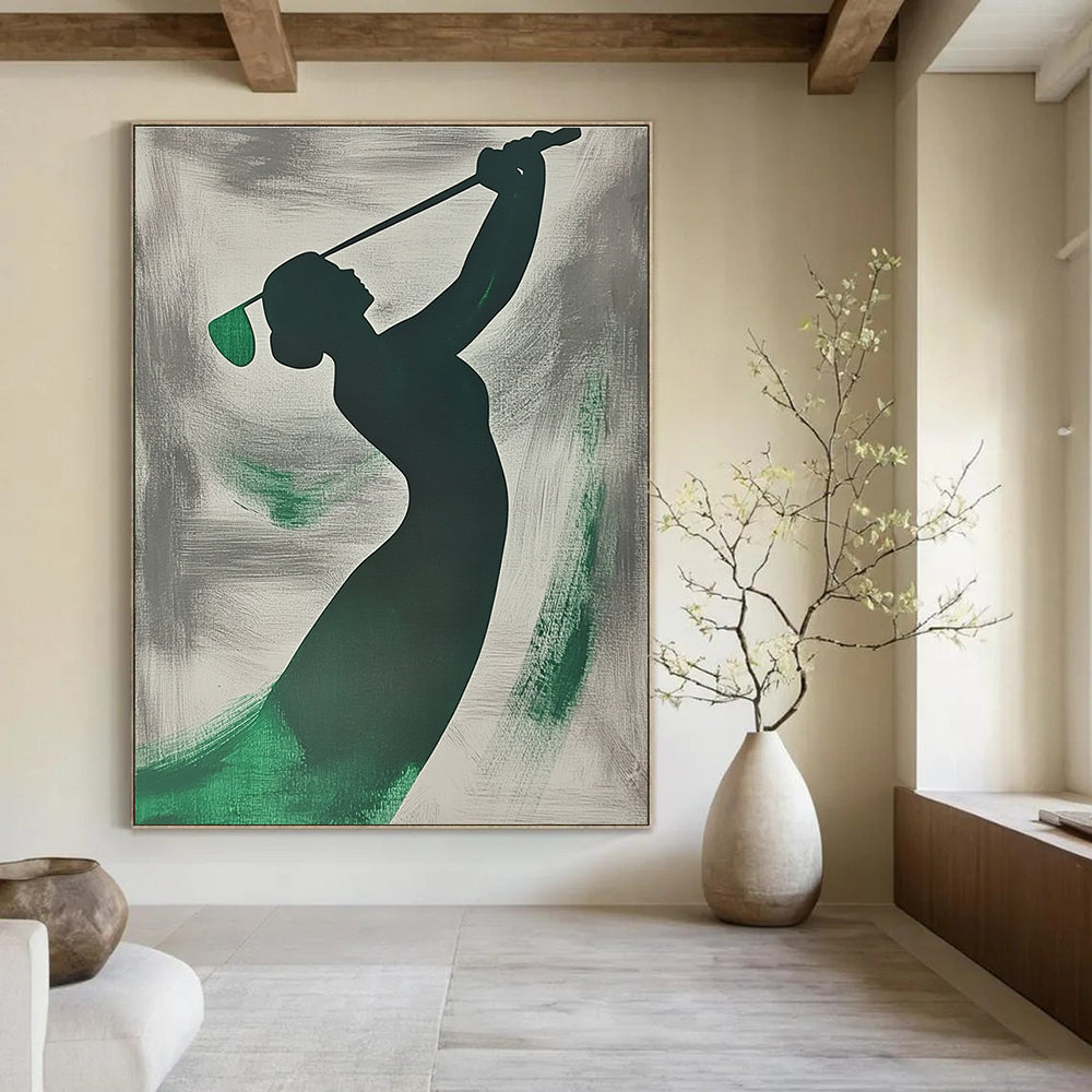 A large abstract painting featuring a silhouette of a woman playing golf with emerald green brushstrokes on a grey background.STSC1065