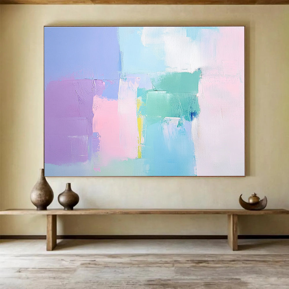 Large abstract painting with soft pastel colors thick brush strokes and a minimalist impressionist style featuring pink blue and light green tones.SC255