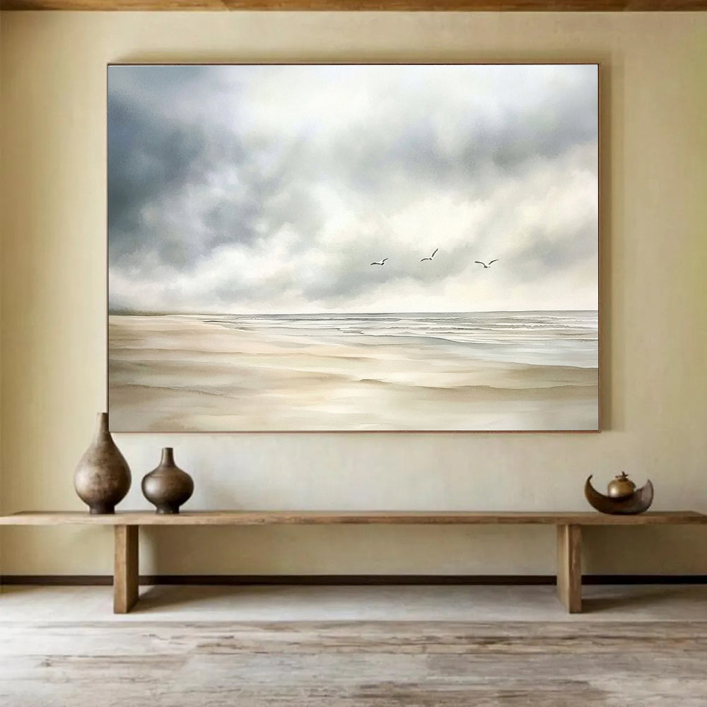 Large abstract watercolor depicting a calm beach scene with muted colors, seagulls in the distance, and a soft cloudy sky on a white background.SC616