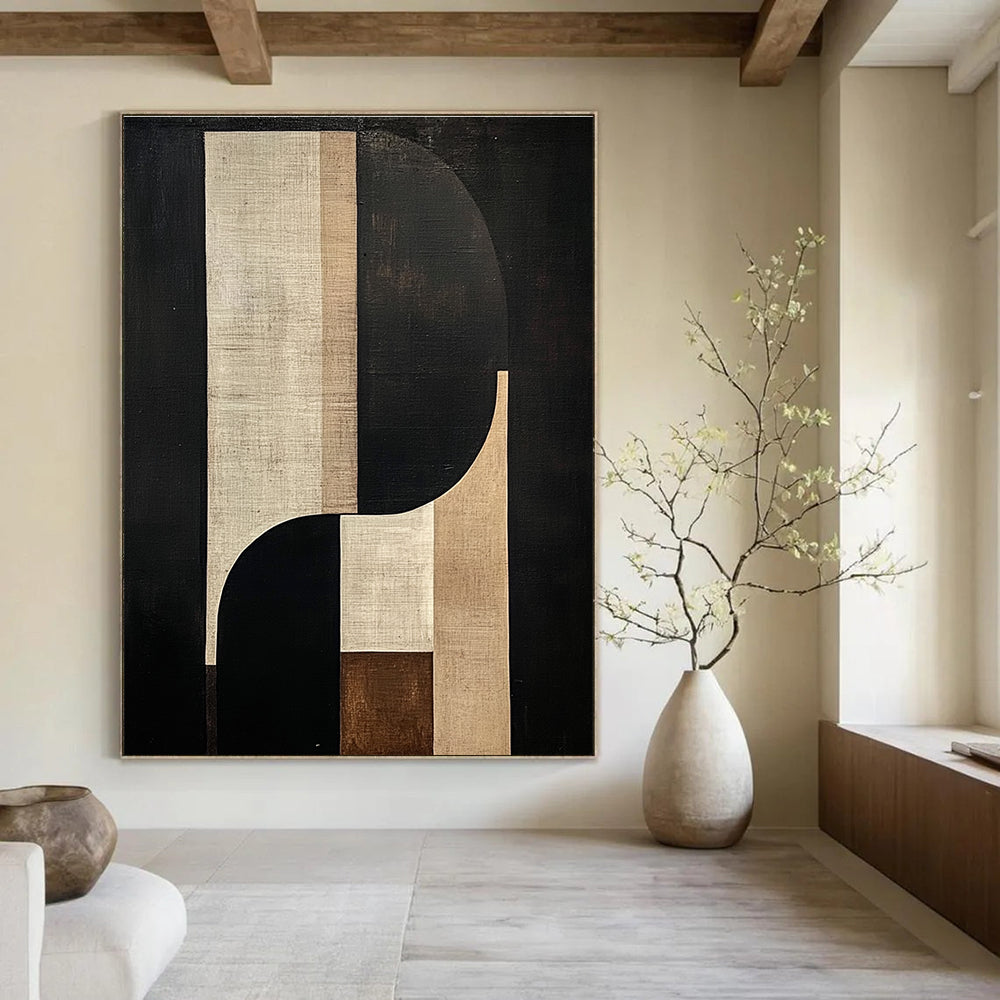 Large abstract painting features geometric and organic shapes in beige and brown tones against a black background with a central tall white shape.STSC1058