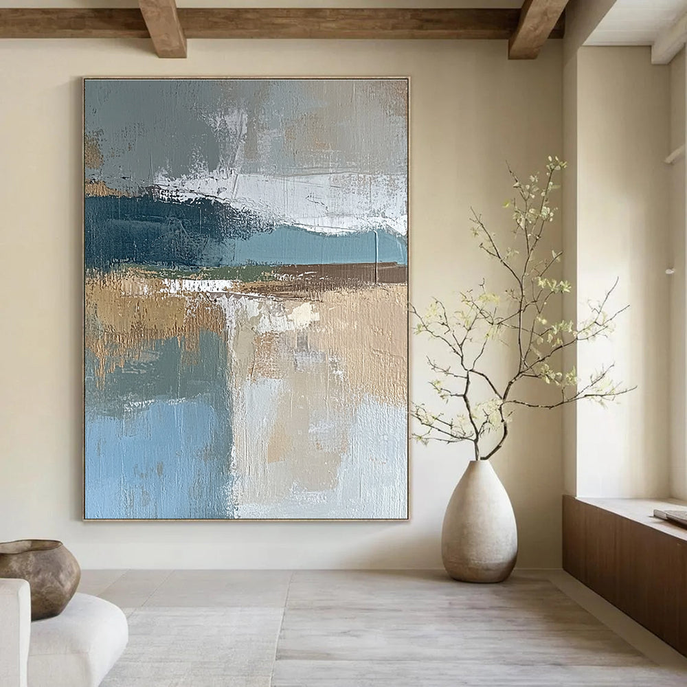 Large abstract painting featuring muted blue gray and brown tones with textured brushstrokes and earthy accents in green and beige.STSC563