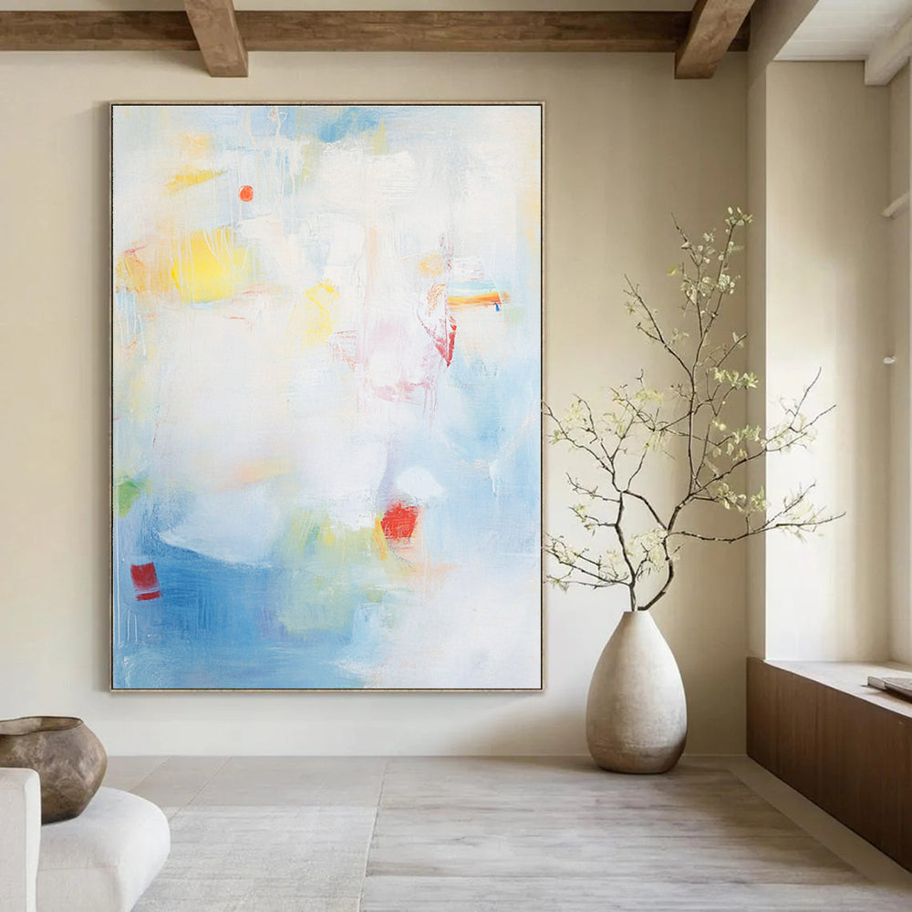 Large abstract painting with a light blue background and soft strokes depicting the sea with waves rocks and fishing boats.STSC401
