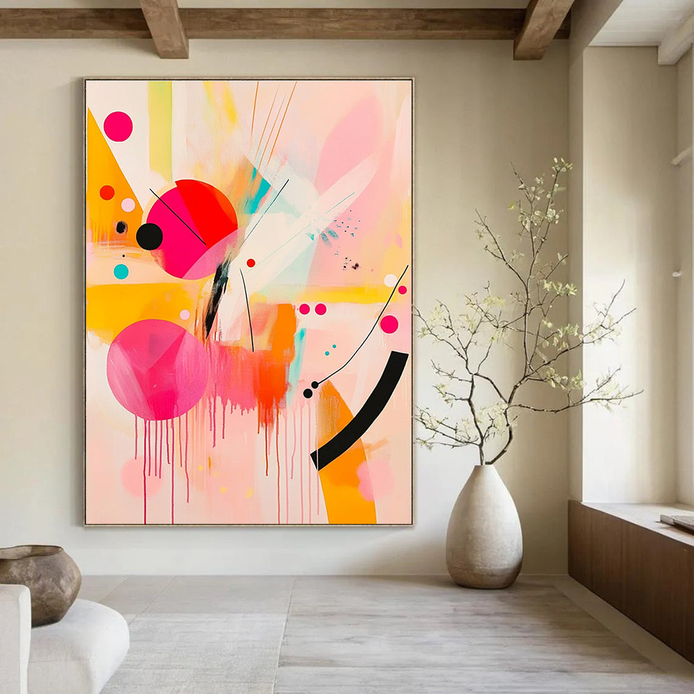 Large abstract painting featuring pink and yellow shapes with black lines and bright orange geometric forms creating a joyful playful composition.STSC790