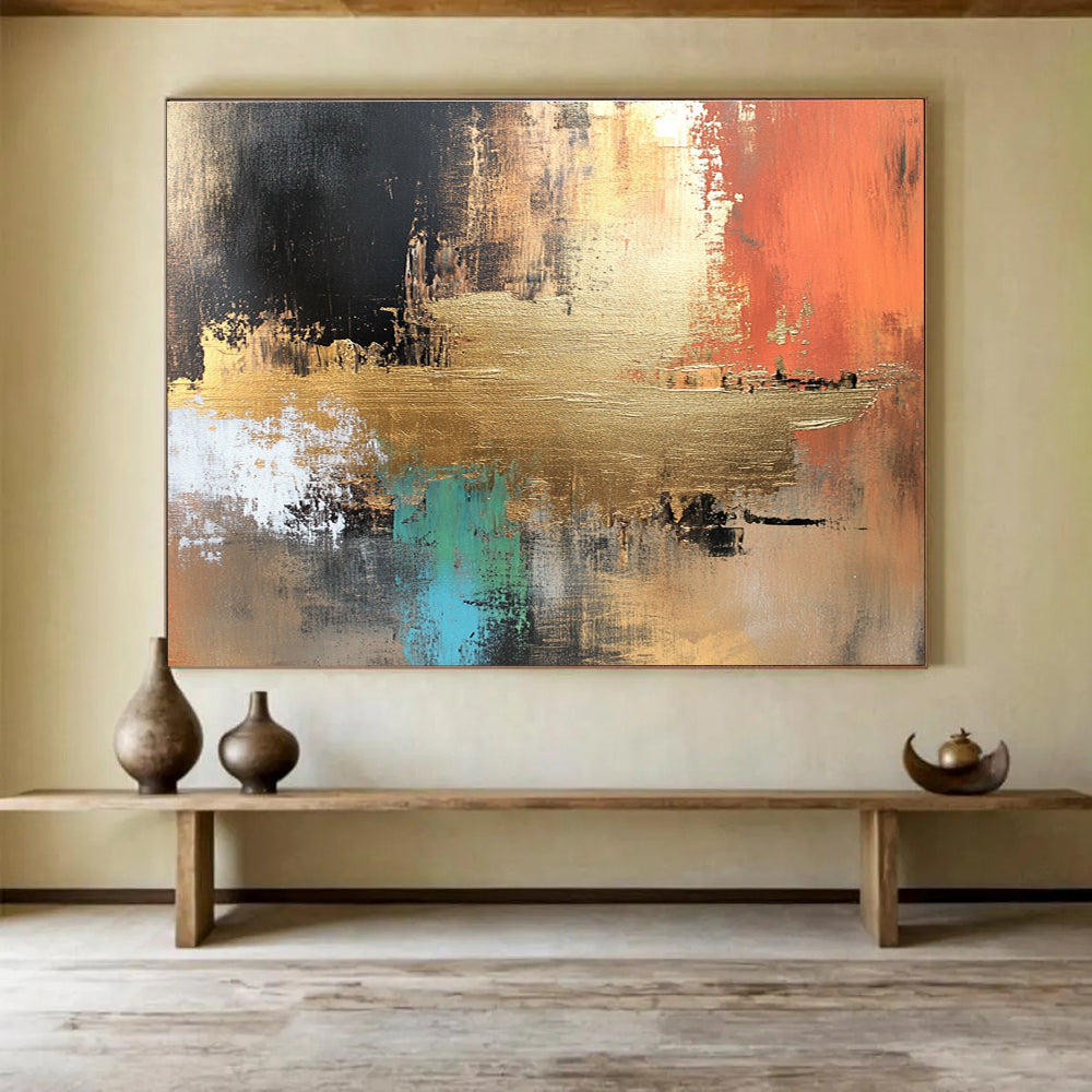 Large abstract canvas painting in golden copper and brown tones with vibrant blue green red black accents featuring white elements and light gold foil details.SC091