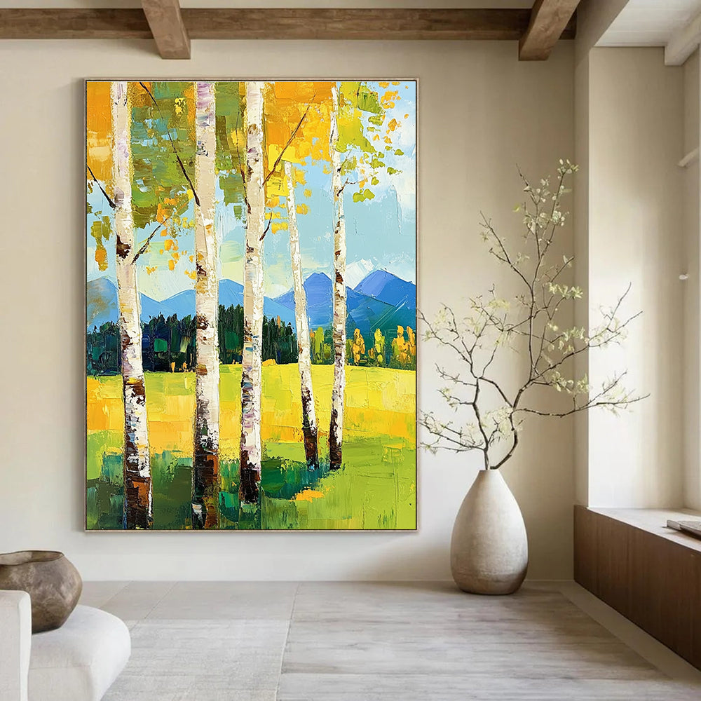 Large abstract painting featuring birch trees in spring vibrant greens and yellows with mountains in the background and thick expressive brush strokes.STSC871