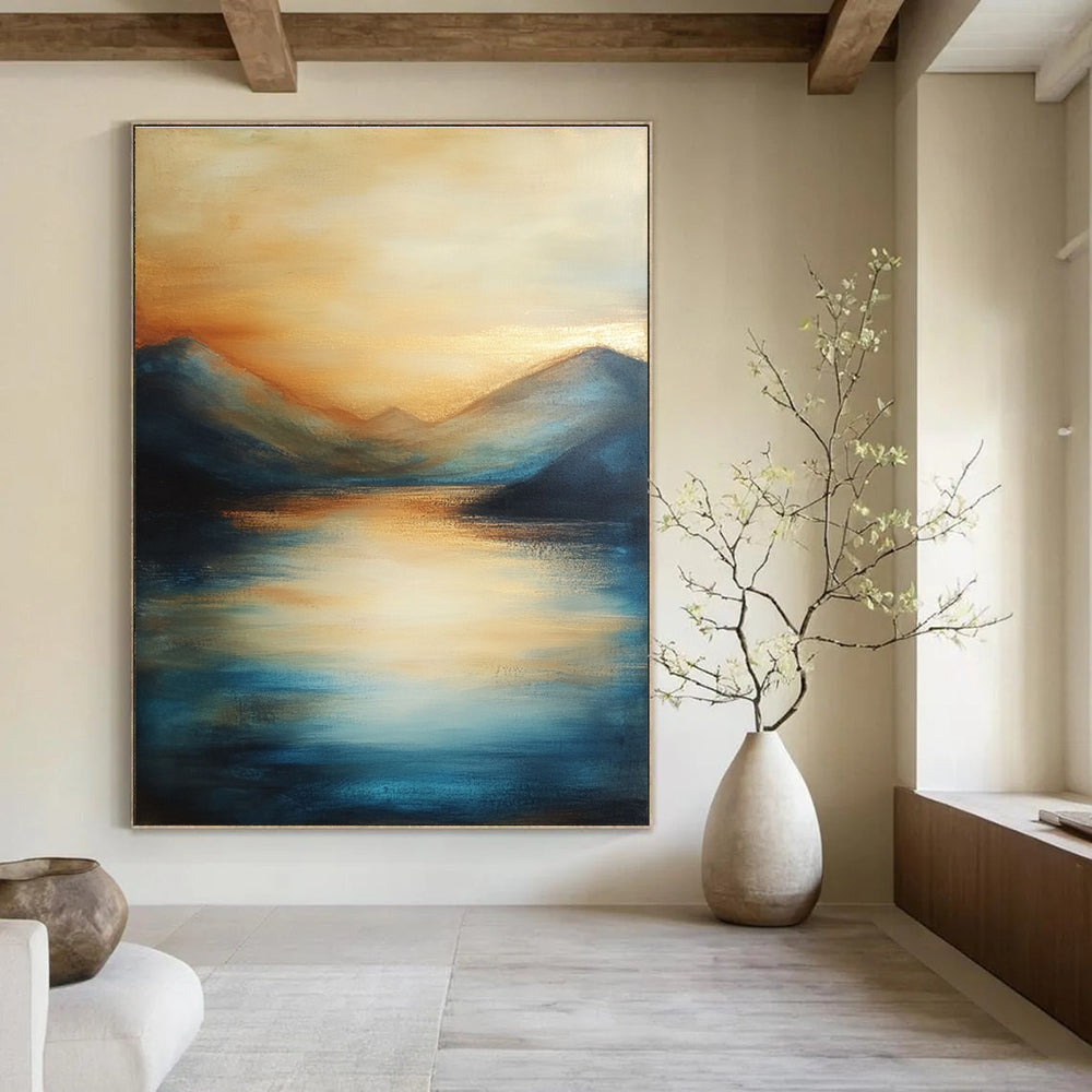 Large abstract painting of the sea featuring soft brush strokes with blue tones and golden accents creating a serene sunset atmosphere.STSC092