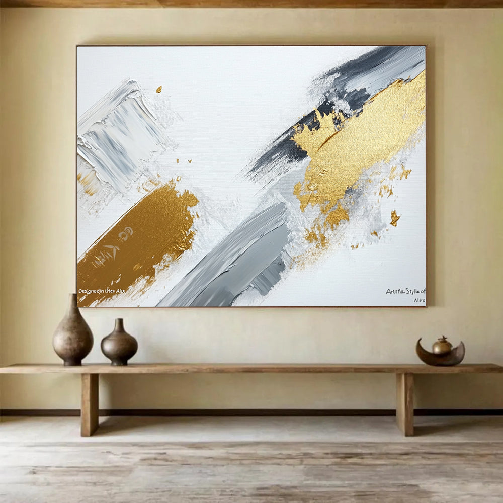 Large abstract painting featuring gray and gold brush strokes on a white background showcasing contemporary artistic creativity and elegance.SC293