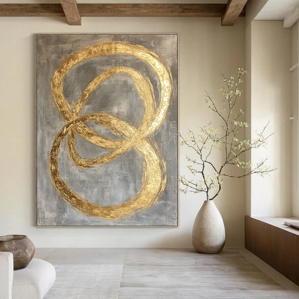 Large abstract painting featuring intertwined O-shapes in gold leaf on a modern grey background.STSC1295