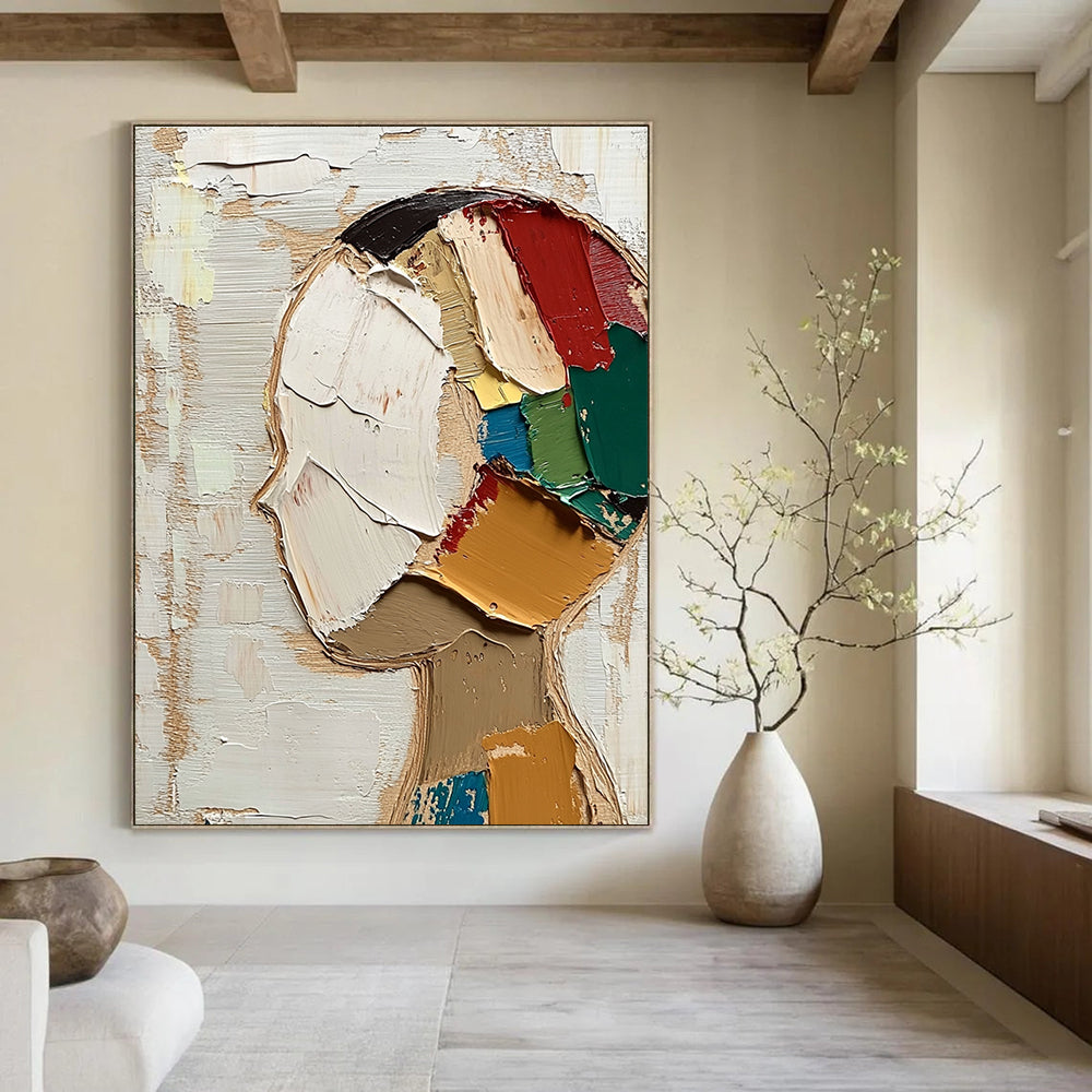 Large abstract painting featuring a round face with short hair in vibrant colors against a beige and white background with visible brush strokes.STSC197