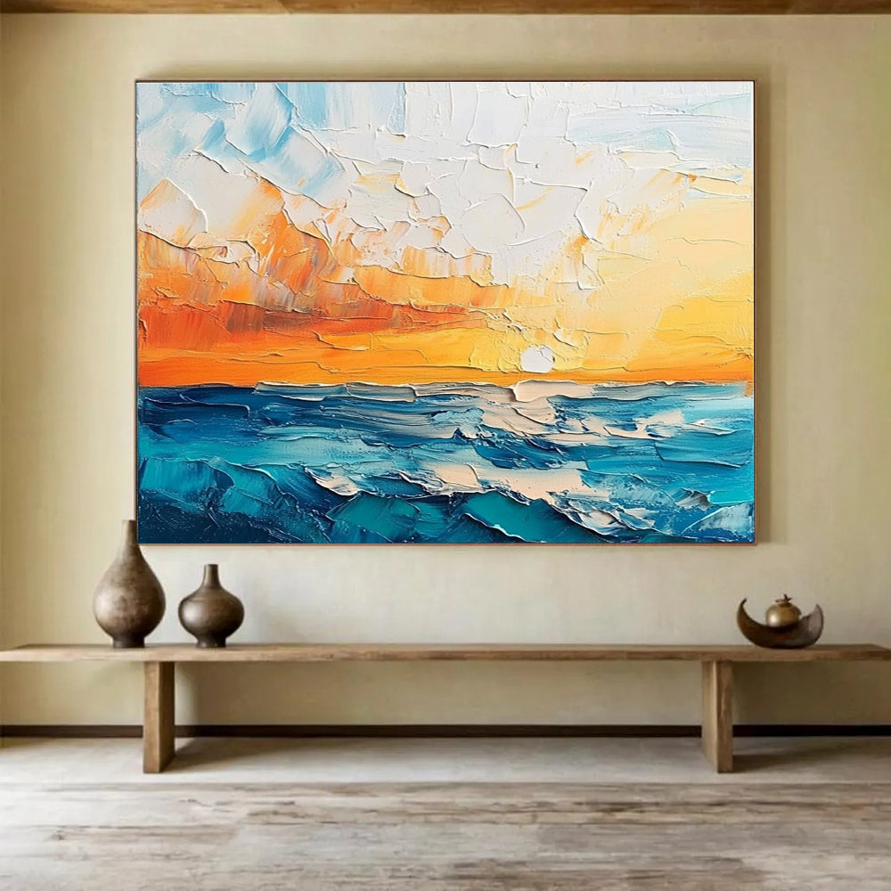 Large abstract painting featuring a textured sunset over the sea and sky in orange blue white and teal shades.SC132