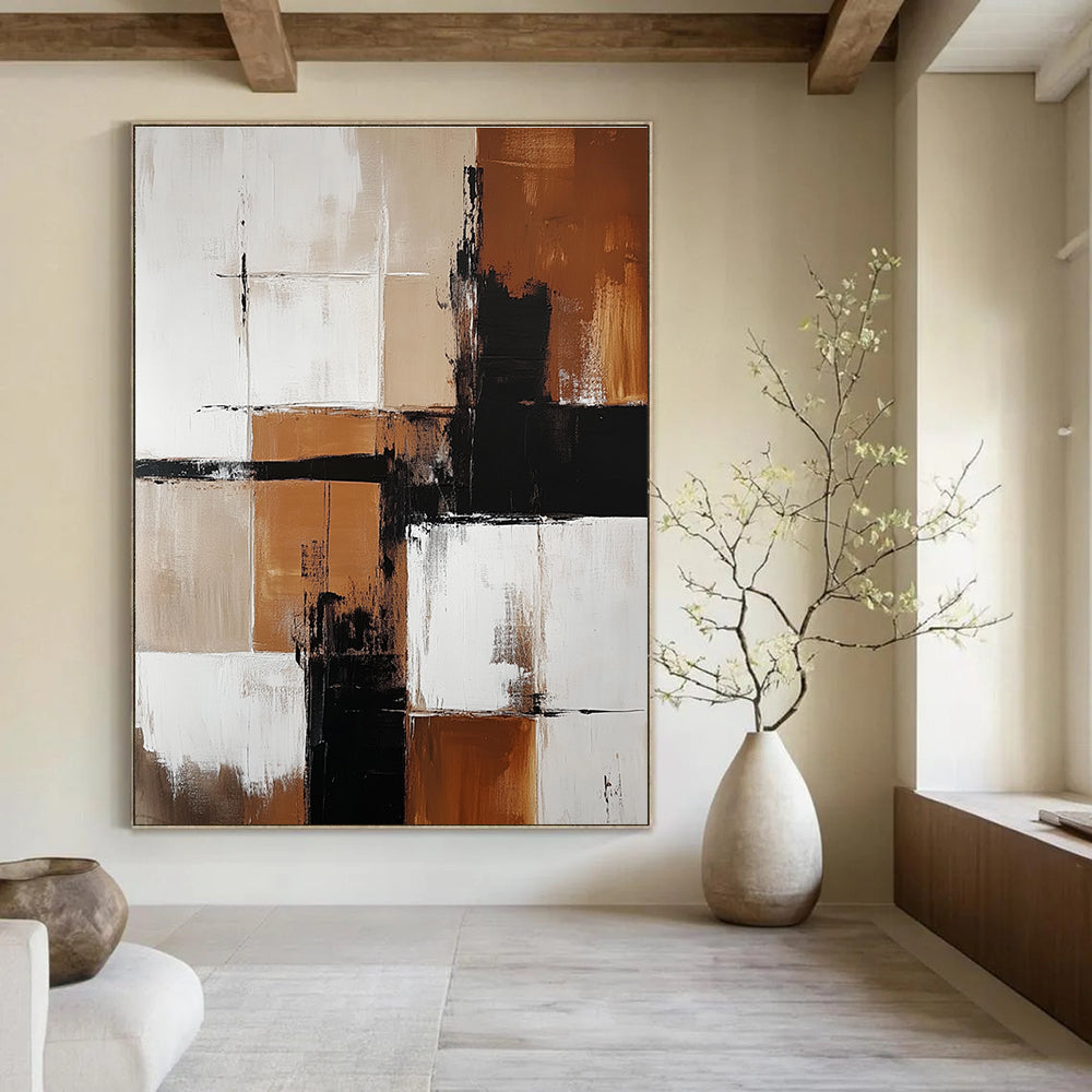 Abstract painting featuring brown and white color blocks with minimalistic black shapes enhancing each section creating a striking visual impact.STSC415