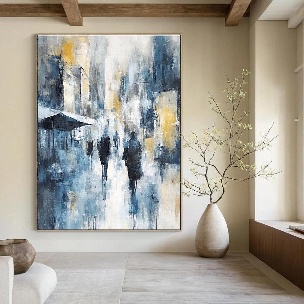 Large abstract painting of an urban cityscape in cool blue tones with hints of yellow and gray showcasing soft brushstrokes and impressionist influence.STSC277