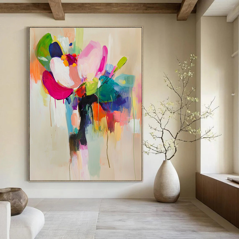 Large abstract painting featuring vibrant colors and soft brushstrokes with a flower in a vase on a light beige background.STSC822
