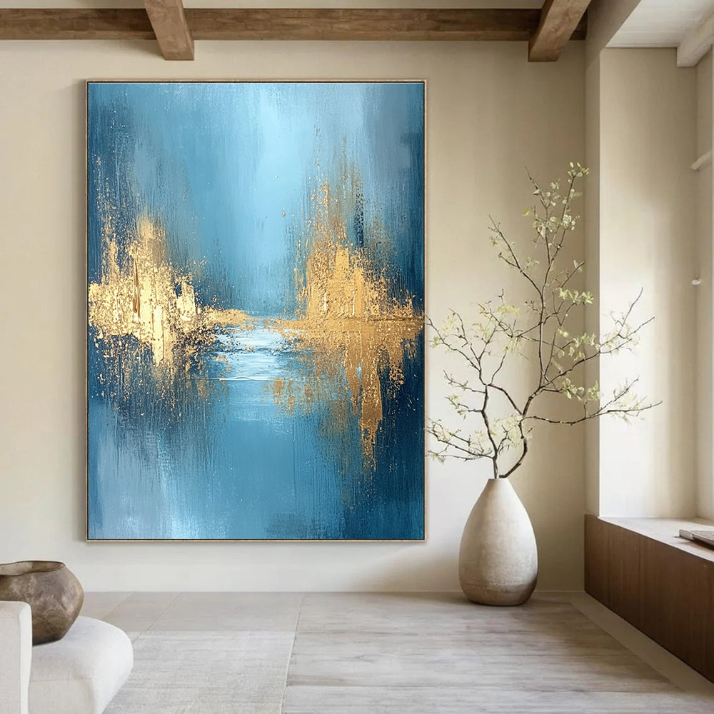 Large abstract painting featuring textured golden water and a misty morning atmosphere with blue grey and white hues for a serene mood.STSC723