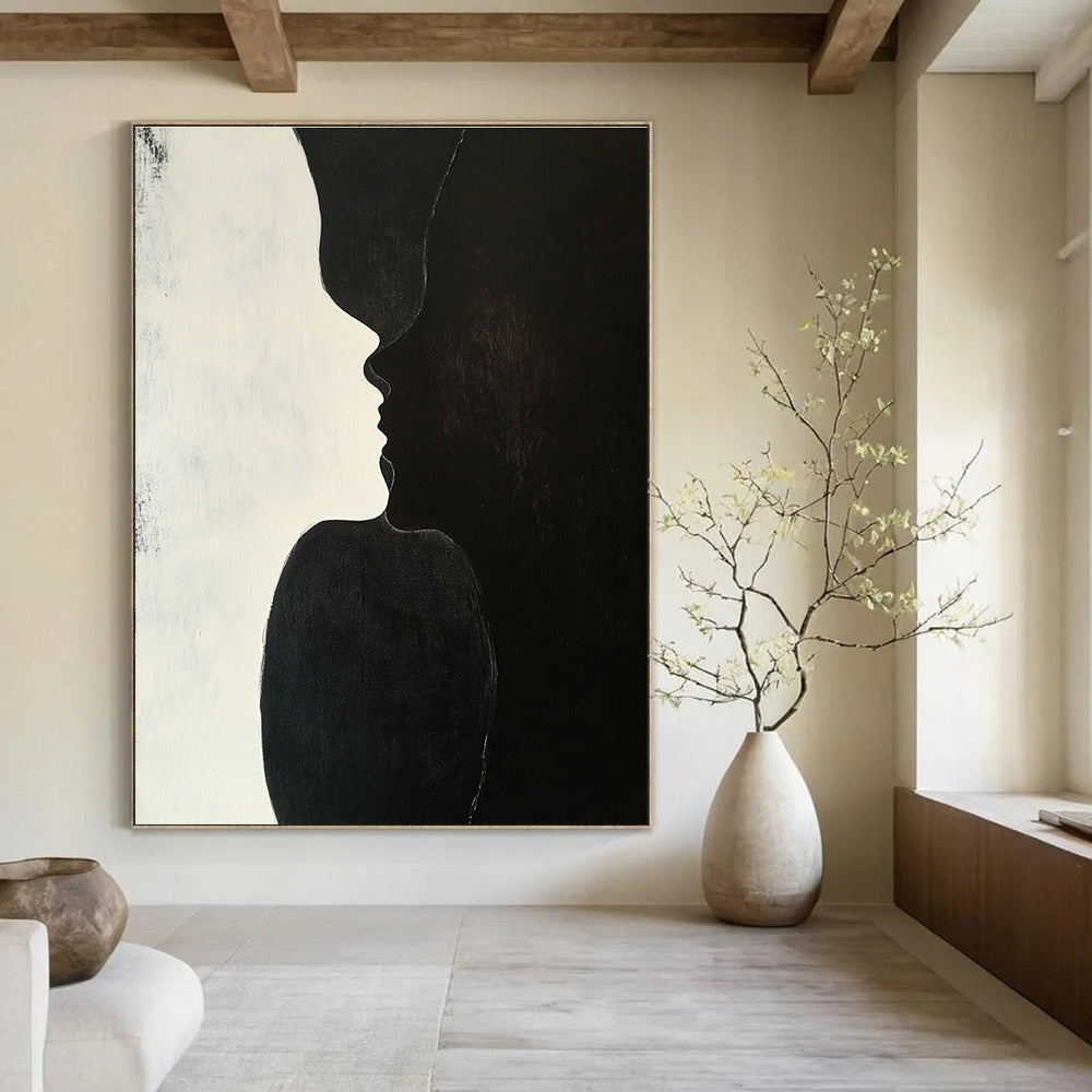 A large abstract painting featuring two figures kissing against a plain black background with subtle shadows highlighting their forms and textures.STSC909