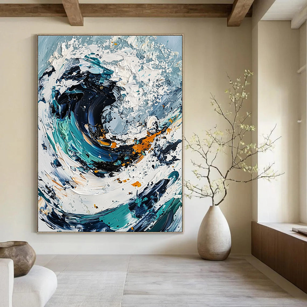 Large abstract painting of an ocean wave in white and blue tones with black center and colorful details created using a palette knife on canvas.STSC263
