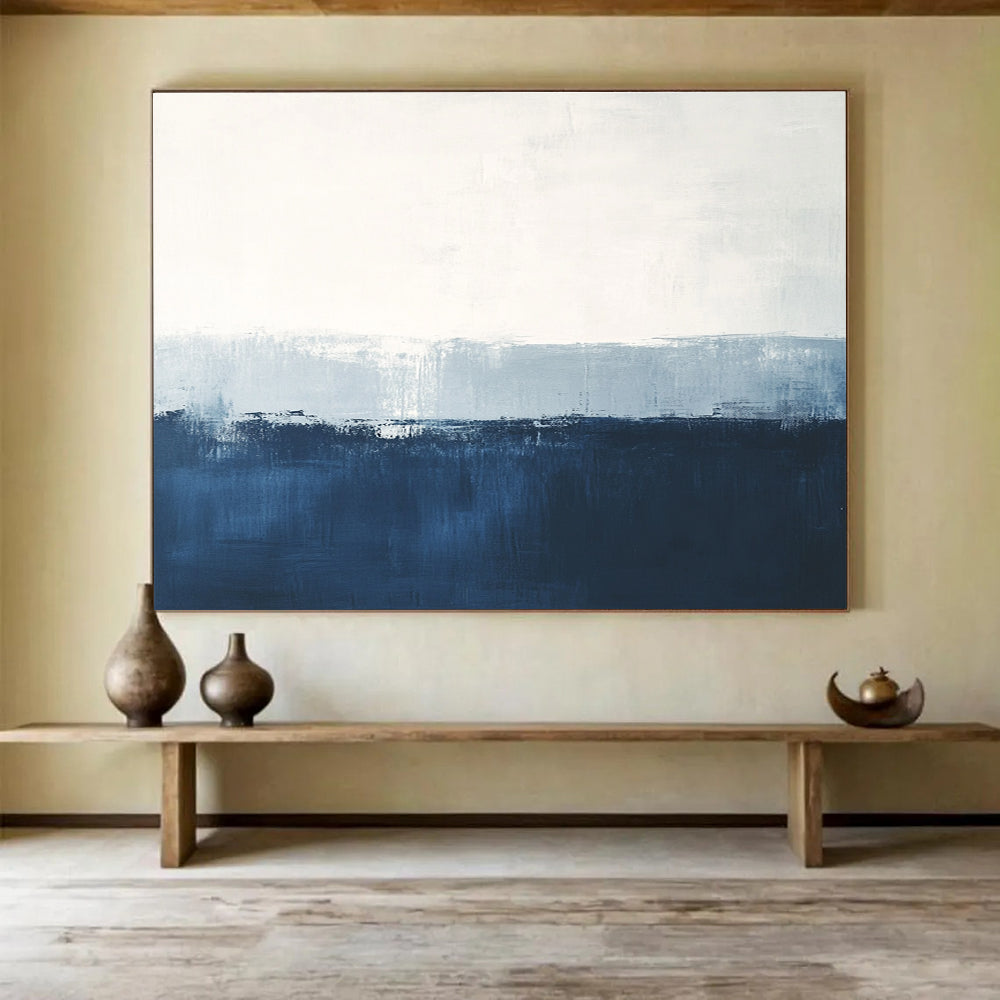 Large abstract painting in calming blue and white with subtle textures tranquil sea view soft edges and atmospheric skies.SC027