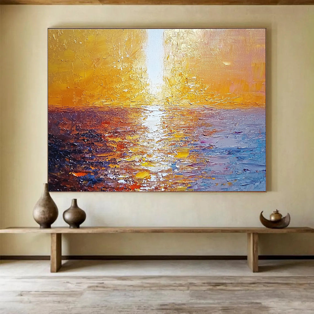 Large abstract painting of a golden sunset over the sea with a white beam illuminating the water surface from the top-left corner.SC111