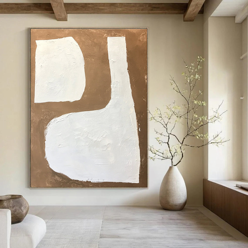 Large abstract painting featuring white shapes on a brown background with textured brushstrokes in a minimalistic style.STSC1484