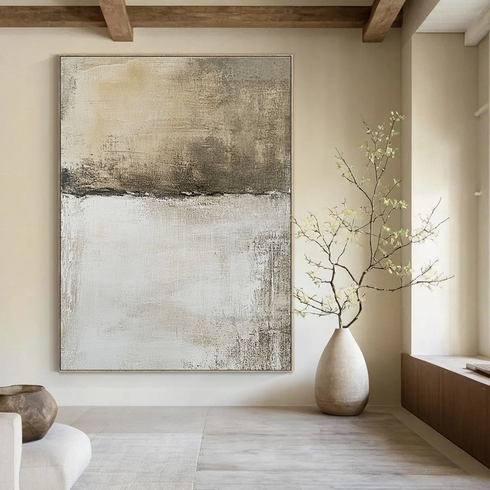 Large abstract painting features a neutral background with faded textures and brown shapes, evoking an aerial view of a landscape.STSC1103