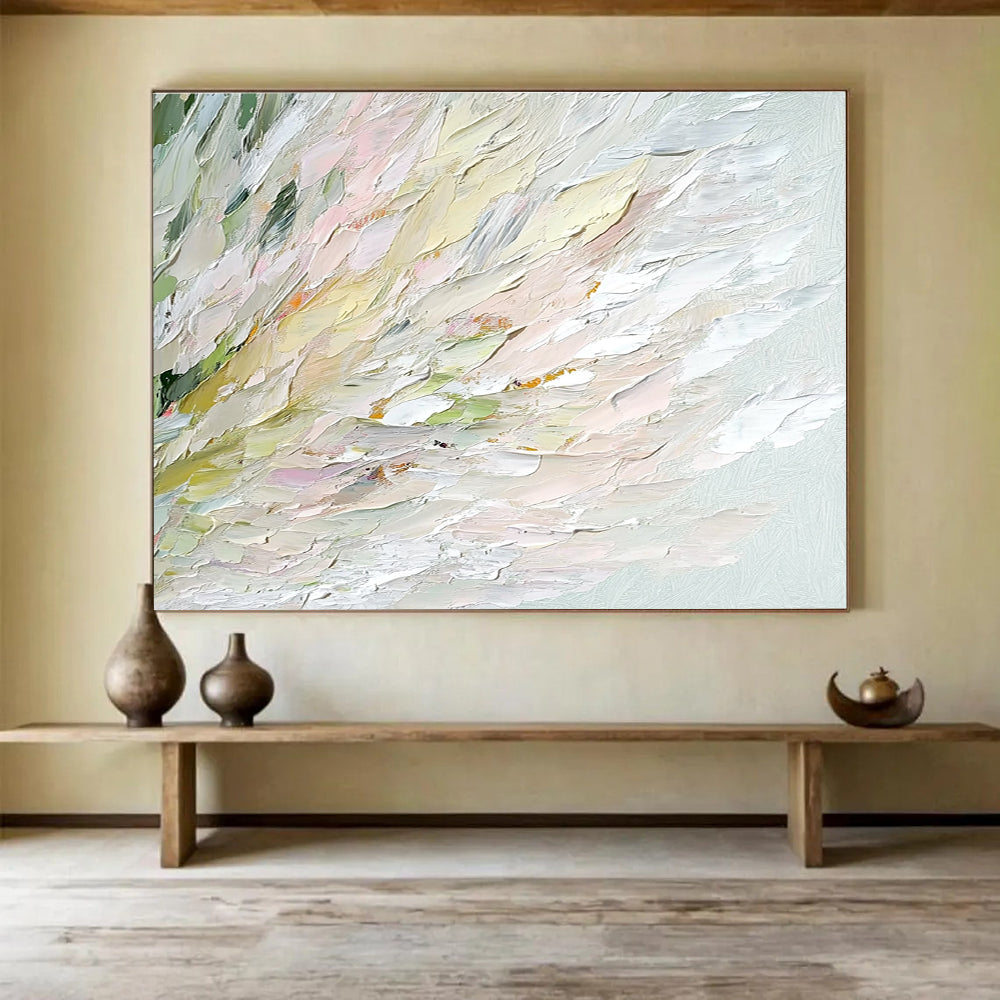 An abstract oil painting features soft swan feathers in whites greens pinks and yellows with a blurred water ripple background enhancing tranquility and elegance.SC450