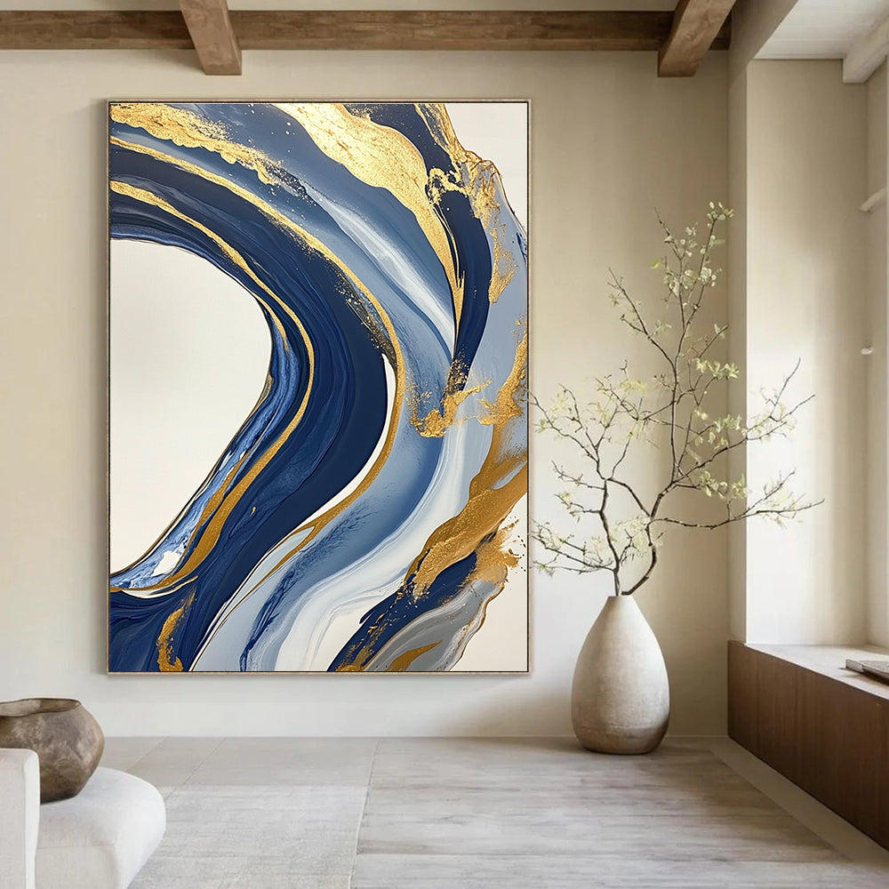 Large abstract blue and gold painting featuring marbling on a white background with swirling gold lines and fluid shapes creating luxurious textures.STSC032