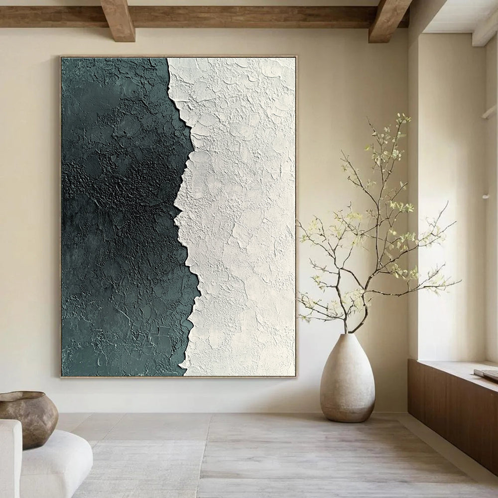 Large abstract painting of textured white and grey plaster with deep green accents showcasing detailed patterns and a captivating grainy finish.STSC836