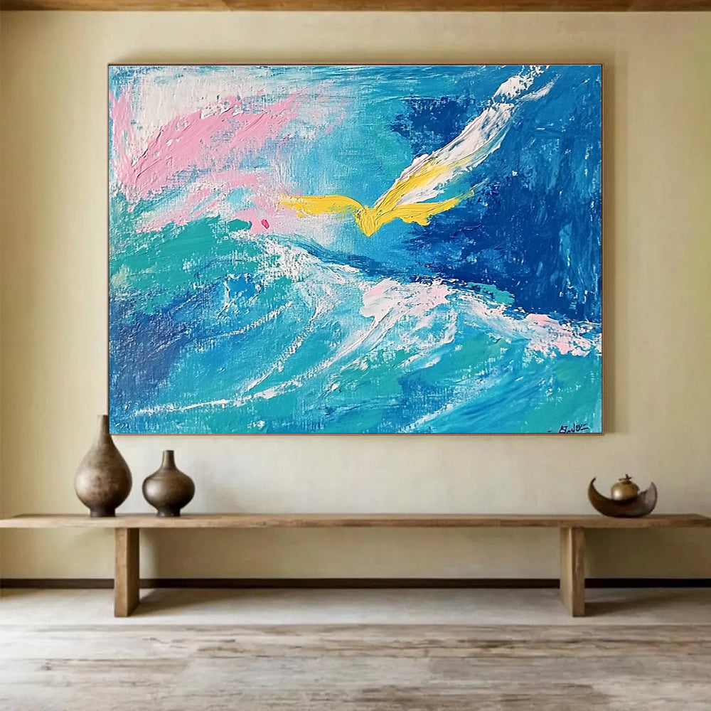 Large abstract painting featuring fluid turquoise and blue tones with pink highlights, a yellow bird, and a whimsical smile hidden within the waves.SC364
