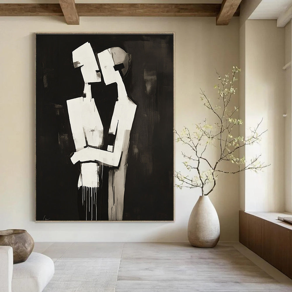 Abstract black and white painting of two figures embracing in a deconstructed minimalist style against a dark background.STSC024