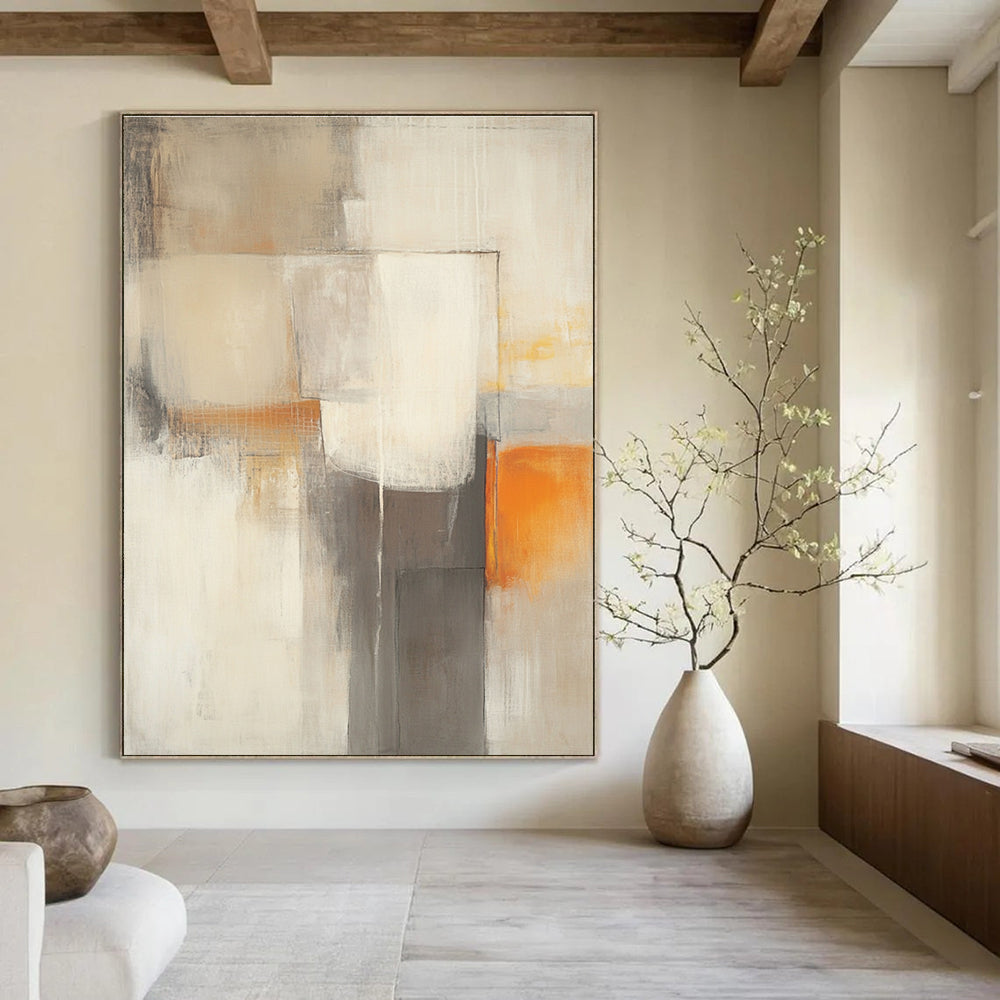 Large abstract painting in beige and grey tones featuring blurred geometric shapes and a subtle orange accent for vibrancy.STSC753