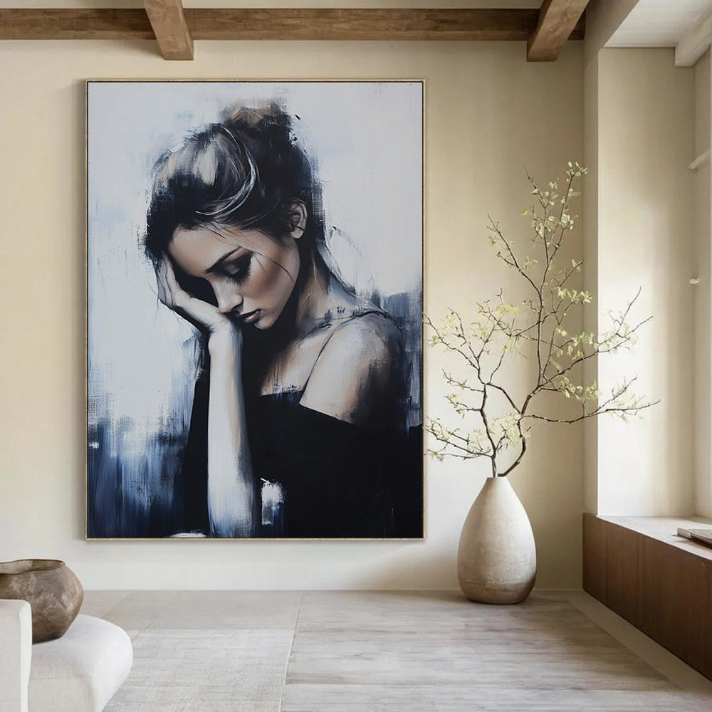 Abstract painting featuring a woman in soft tones with elegant figures and broad brushstrokes set against a minimalist background of gray and blue hues.STSC1266