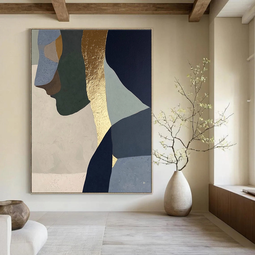 Abstract painting with gold foil depicting a woman in profile, blended neutral tones of sage green, blue, gray, beige, and navy blue.STSC756
