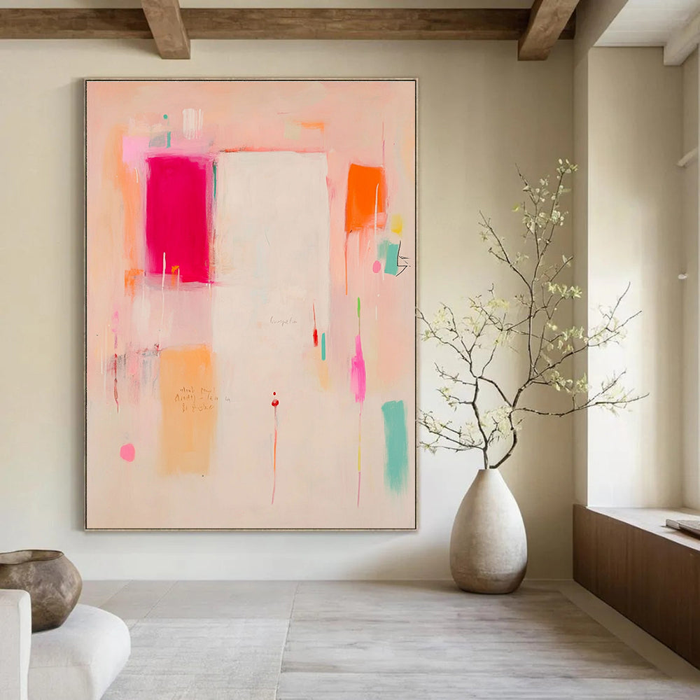 Large abstract painting in soft pink peach and orange tones featuring a white central area with red and yellow accents and expressive shapes.STSC809