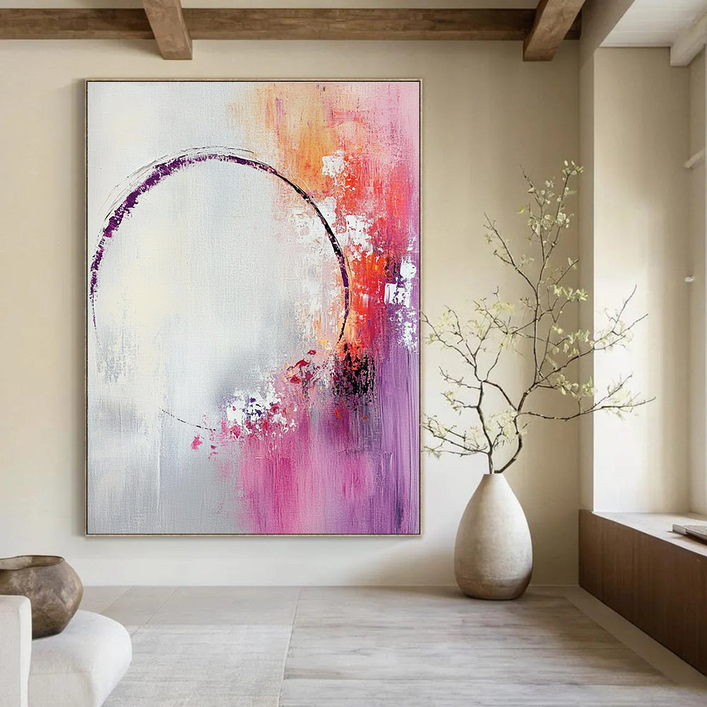 Large abstract painting featuring light pink and white shapes with a soft gray background and tranquil accents of purple and red.STSC429