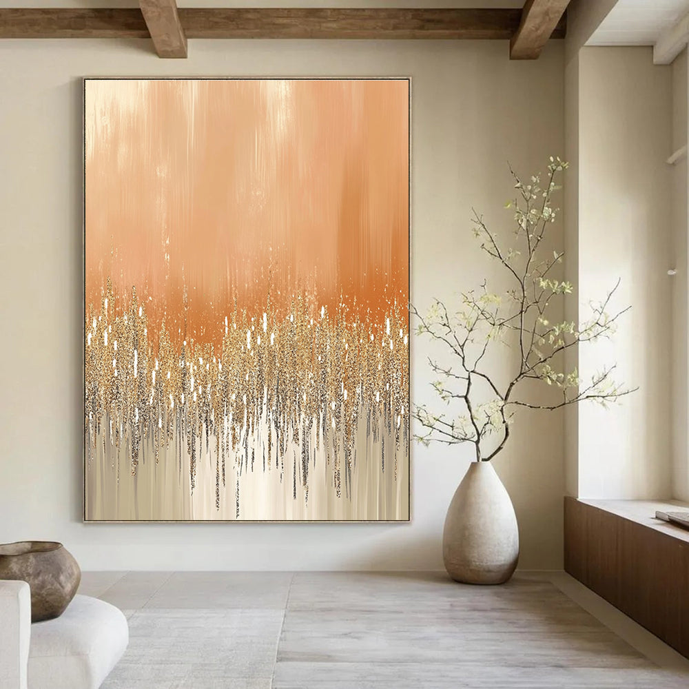 Large abstract painting featuring glittery gold and silver dust on a peach-fuzz beige background ideal for festive or glamorous settings.STSC980