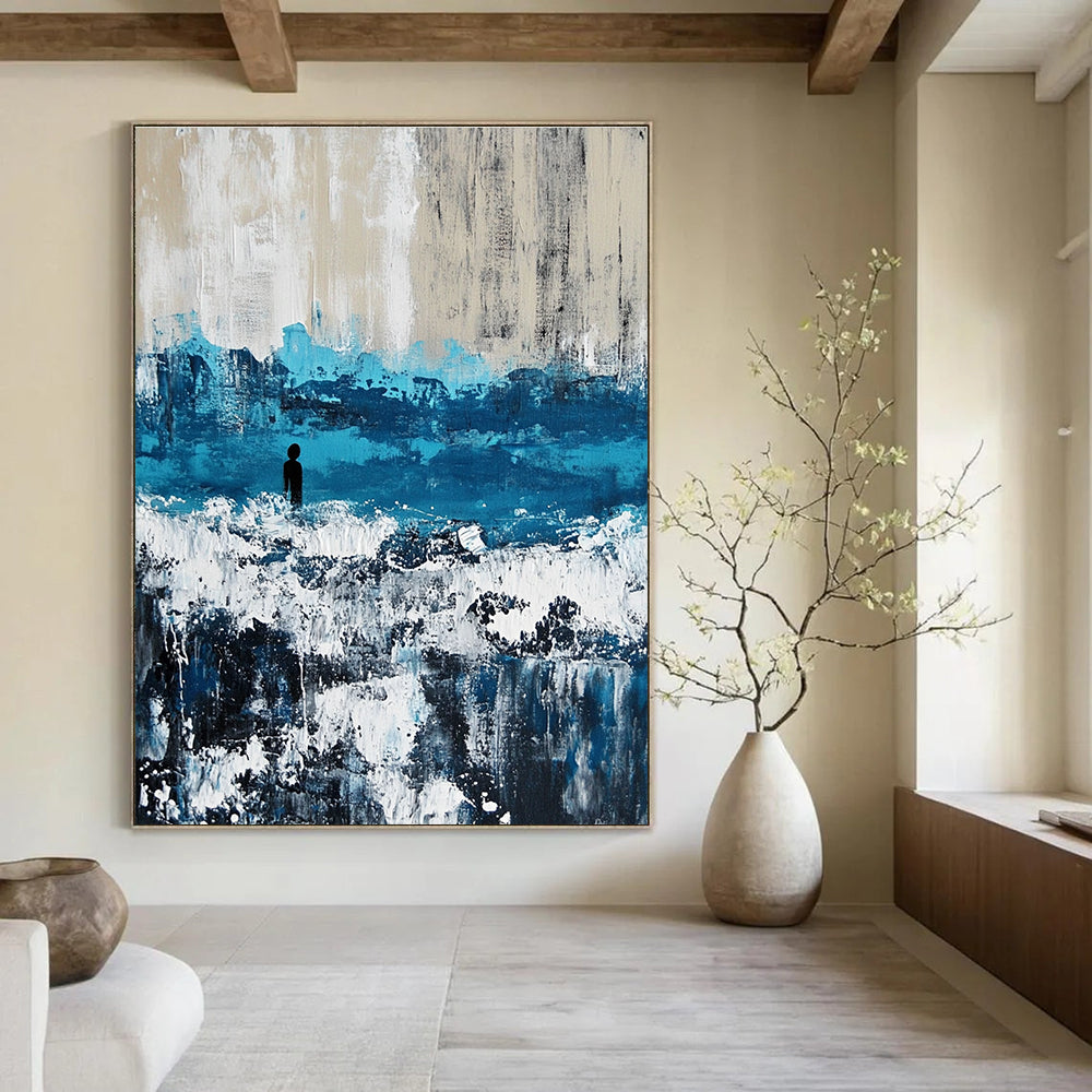 Large abstract painting of an ocean with waves in blue and gray featuring white caps for a serene coastal ambiance.STSC266
