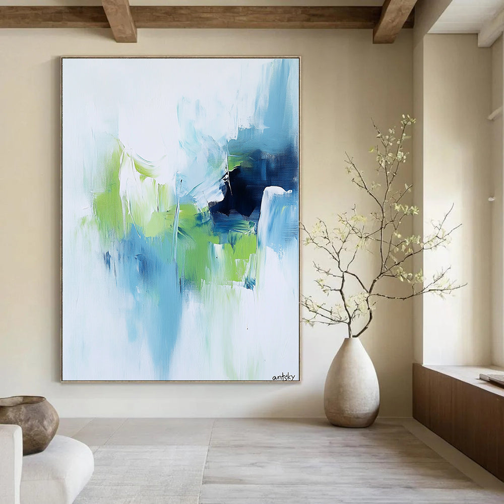 Large abstract painting featuring white blue and green tones with antsky in the lower right corner.STSC826