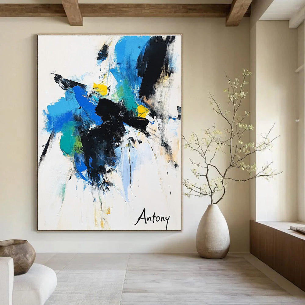 Abstract painting features bold black brush strokes with blue green and yellow accents on a white background with Antony elegantly displayed in large letters.STSC039
