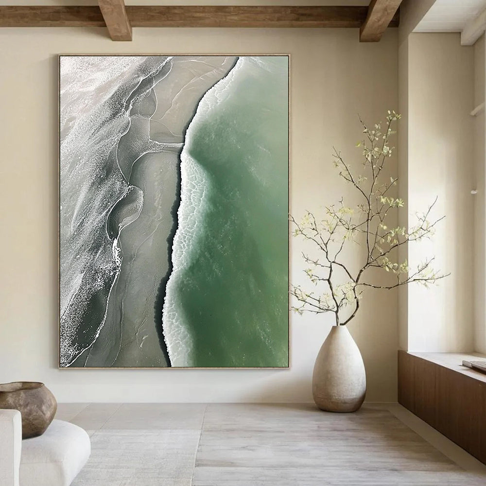 Abstract art piece featuring an aerial view of a beach with green and gray waves flowing onto white sandy shores.STSC529