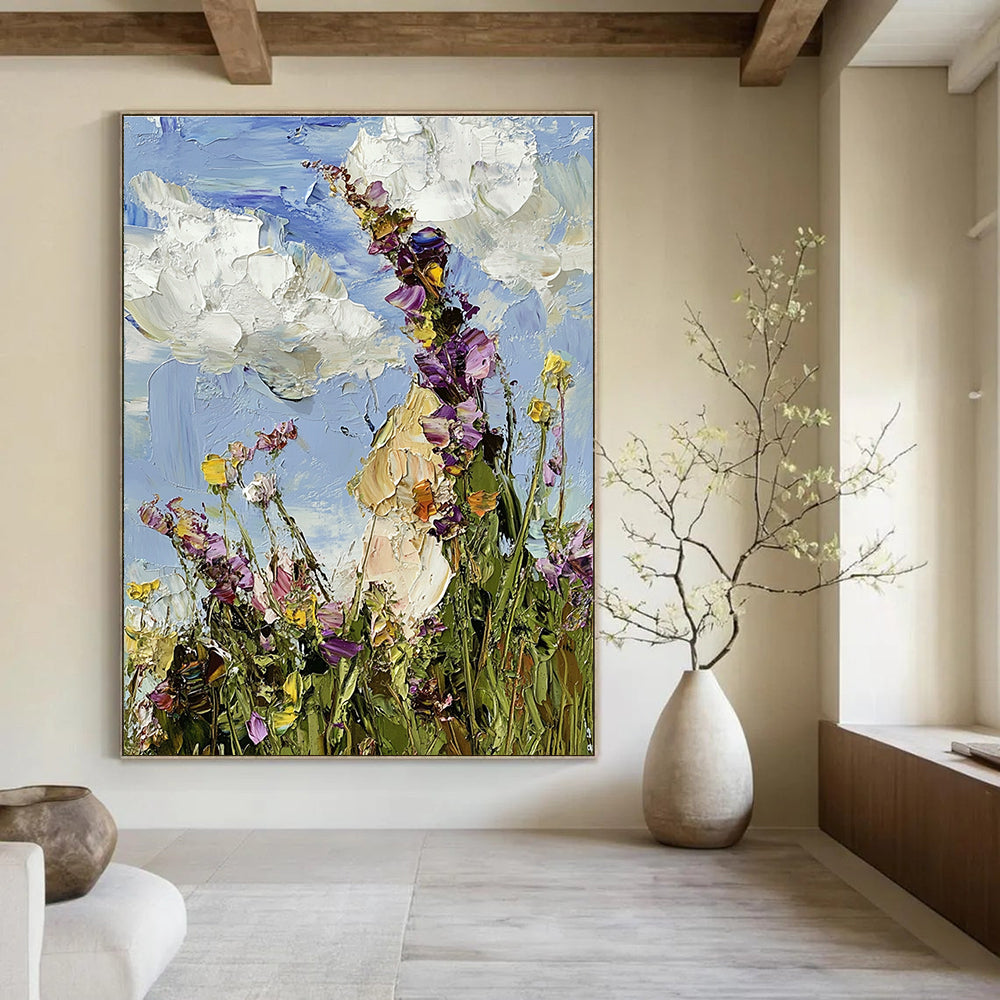 Large abstract oil painting featuring a colorful wildflower meadow under a blue sky with visible brushstrokes in an impressionist style.STSC1367
