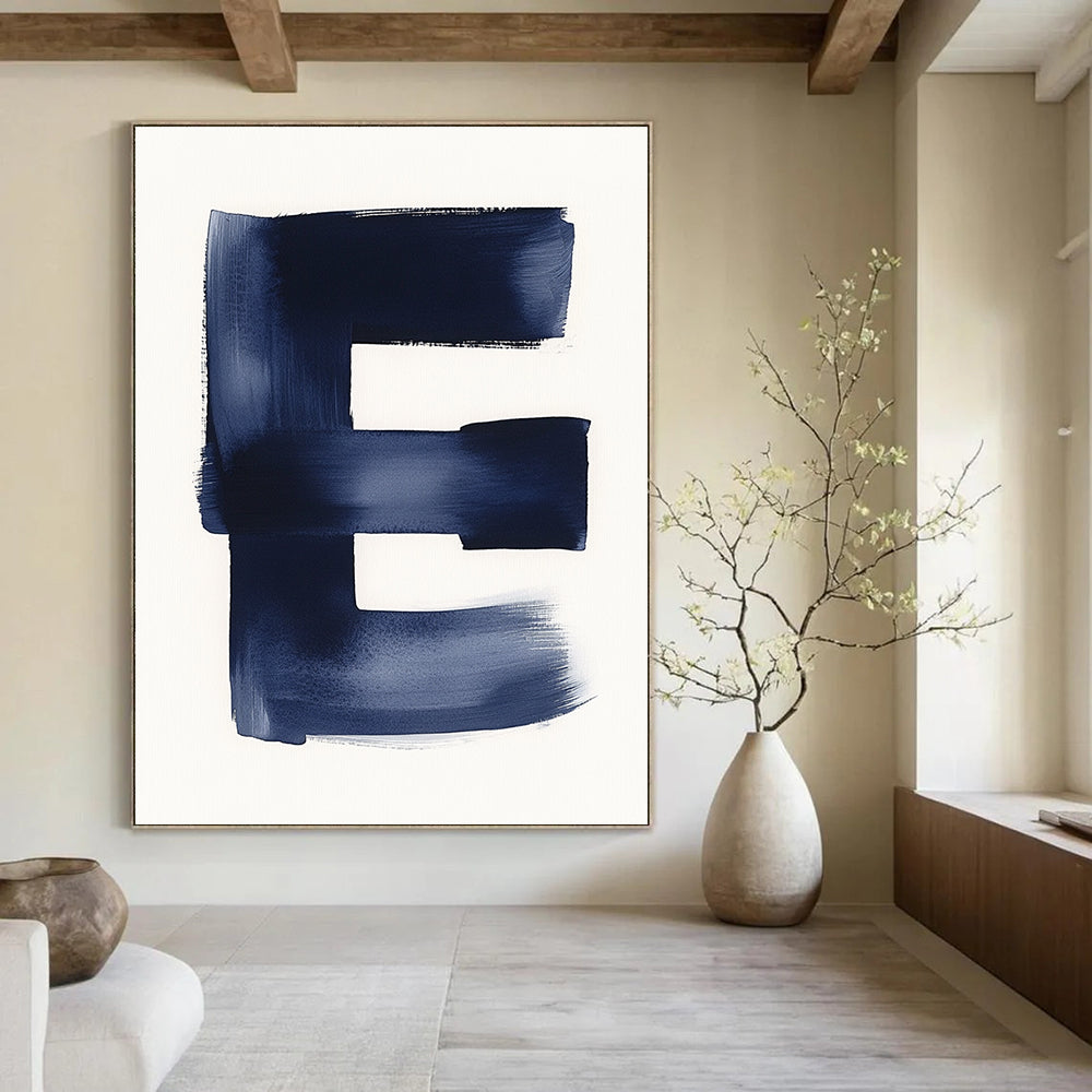 A large abstract painting featuring a minimalist watercolor letter E in navy blue against a white background emphasizing negative space and soft tones.STSC1096