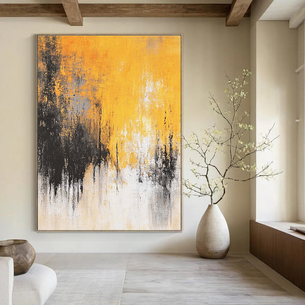 Large abstract painting featuring faded textures and dreamy shades of mustard yellow grey white and black depicting distant trees and a flowing river.STSC728