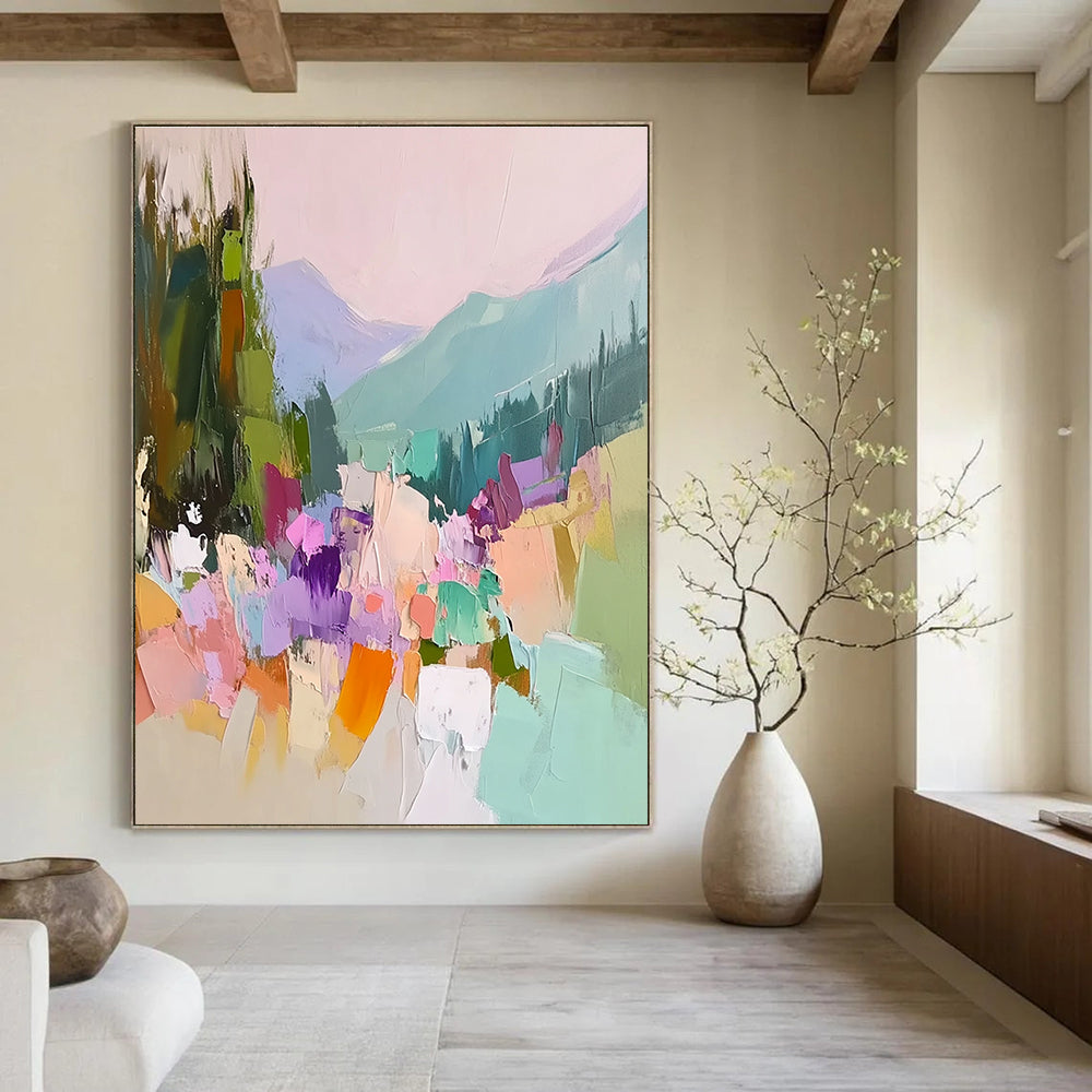 Large abstract painting featuring vibrant colors with trees flowers and mountains showcasing thick brush strokes and textured canvas in a harmonious light pink sky.STSC104