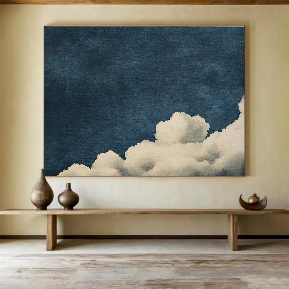 Large abstract painting of clouds on textured canvas featuring high contrast white clouds against a minimalist dark blue background.SC523